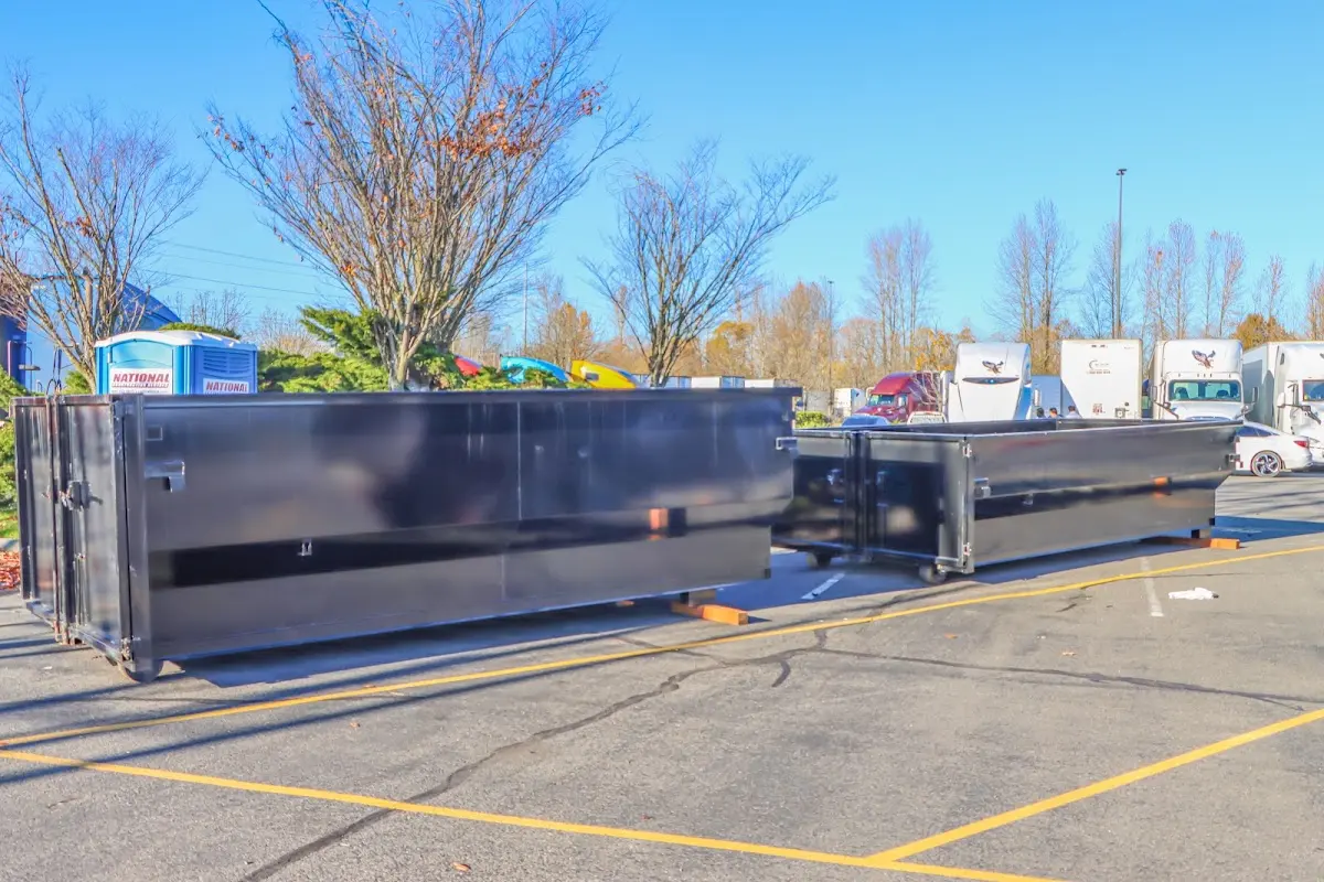 Professional dumpster rental service with roll-off container on residential driveway in Cheney